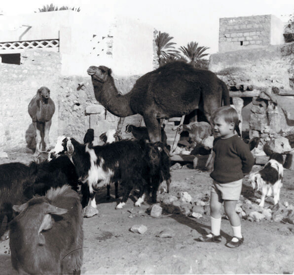 Gregory Hubbs with goats and camels in Morocco