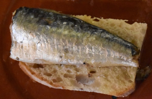 A Portuguese sardine on bread enjoyed in Lisbon.