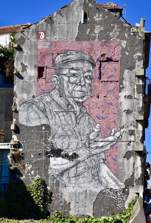 Urban street art Porto. Image of man on building.