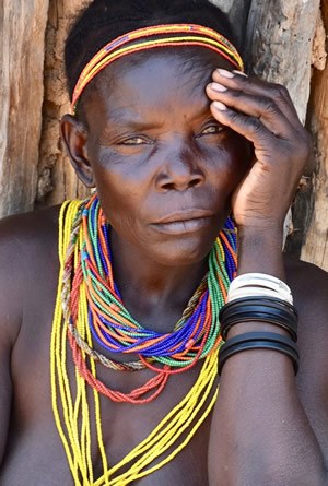 Mucubal woman with the traditional ompota headdress in South Angola.
