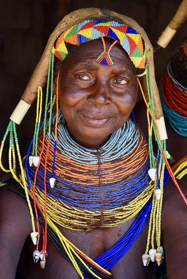 Muila woman with traditional necklaces and dreadlocks in Angola.