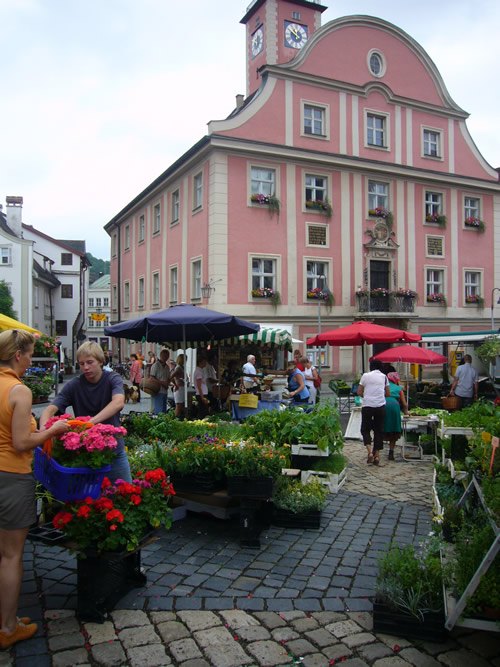 A market takes place on a square in Eichstätt, Germany.