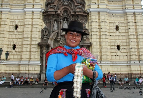A woman in Lima selling tourist gifts in front of the Cathedral.