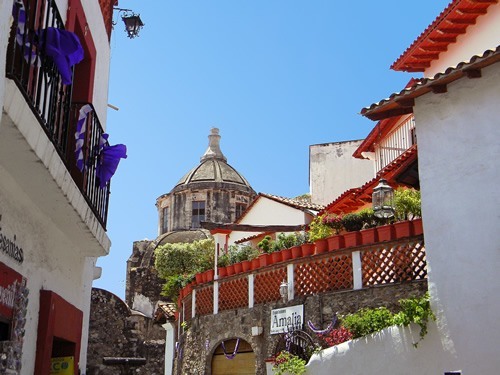 A church and colonial buildings in beautiful town in Mexico.
