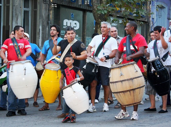 A group of candombe drummers marches through the Barrio Sur neighborhood of Montevideo, Uruguay.