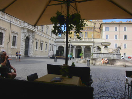 A cafe in on a central Trastevere square in Rome can be a deal with a snack.