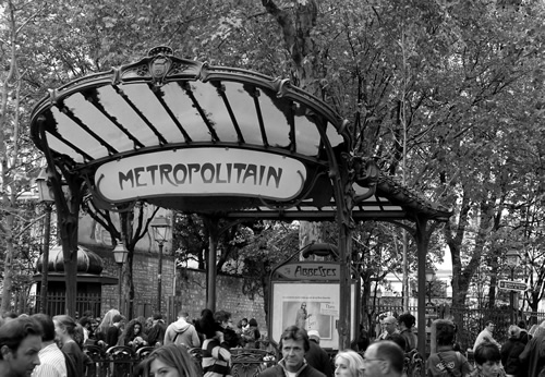 People taking the Paris subway for cheap transportation in Paris.