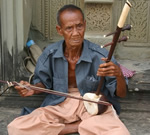 Blind musician in Cambodia in the jungle.