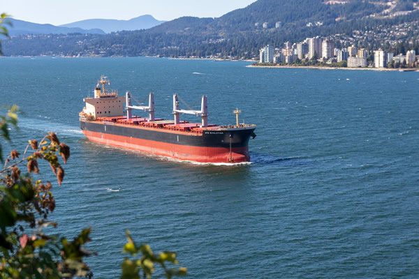 Cargo ship travel by Vancouver.
