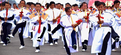 Dancing Miao men in a Nankai village festival.