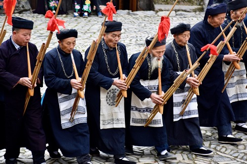 Miao elders playing the lusheng flute.