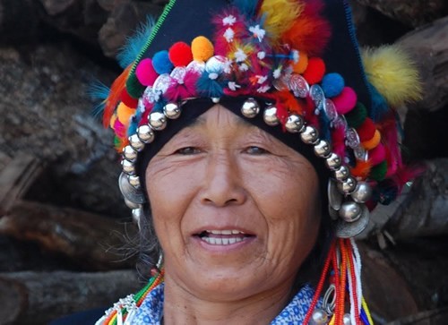 Aini woman with ceremonial headdress.