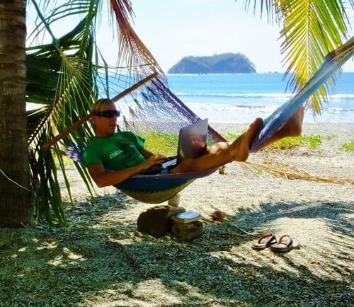 Author in hammock with his laptop writing about the experience of pura vida.
