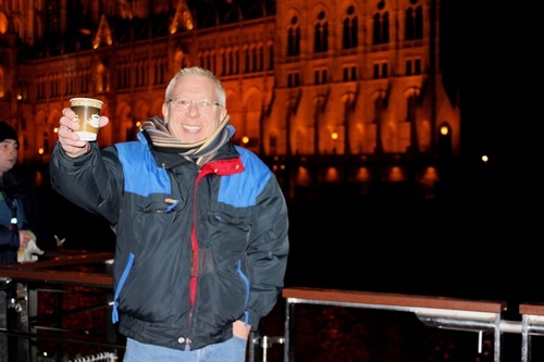 Author holding up a beer in Budapest.