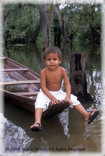 Boy on boat on Amazon.