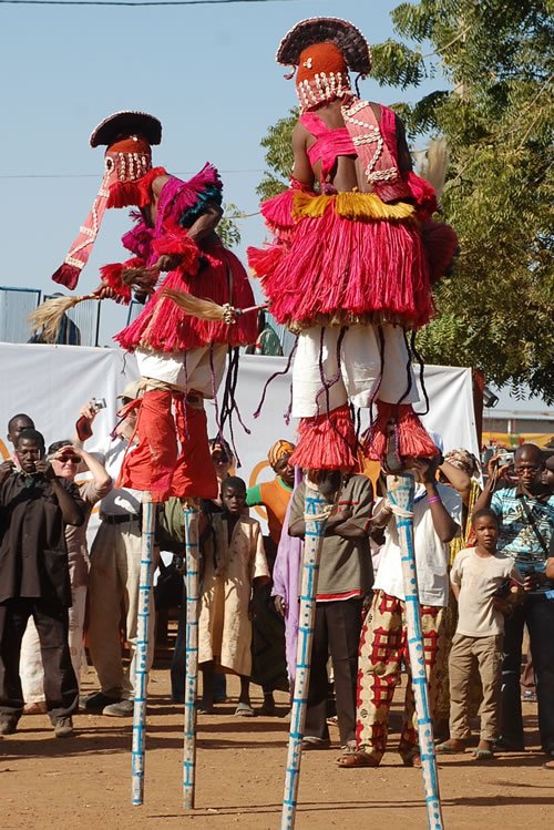 Festival on the Niger: Men on stilts.