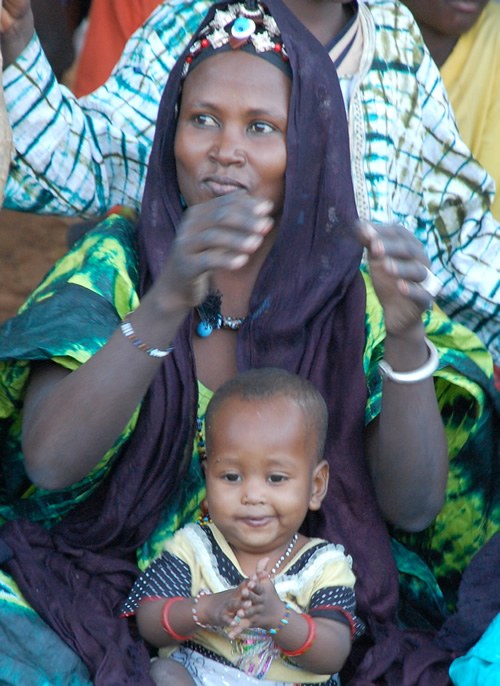 Festival: Woman enjoying with child.