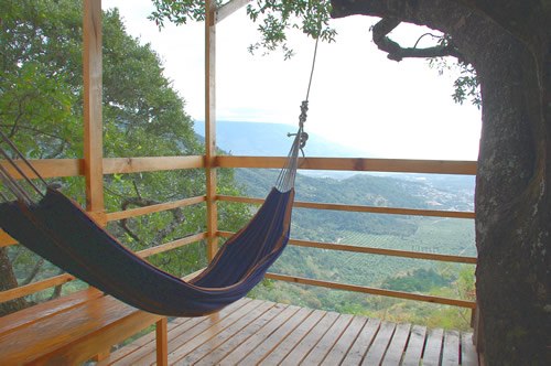 View with a hammock from the tree house in the Guatemalan hills.