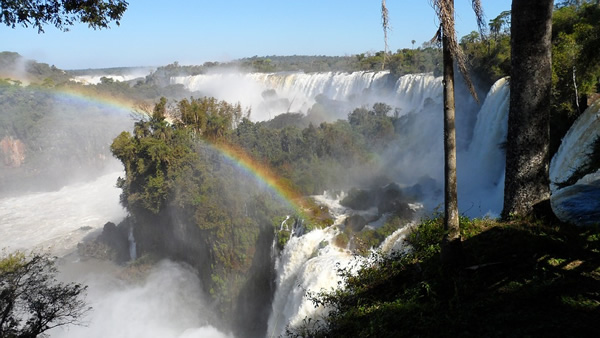 A view of a rainbow over Iguassu Falls, on the border of Argentina, Brazil, and Paraguay.
