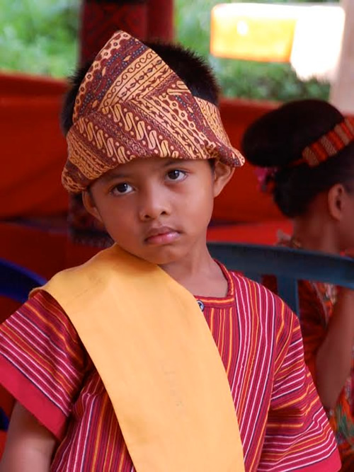 Torajan boy in ceremonial attire in Sulawesi, Indonesia.