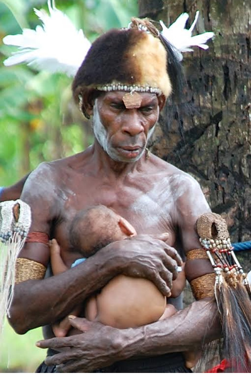 Man holding infant.