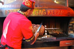 Street food vendor in Turkey serving kepab.
