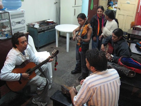 Playing guitar with locals in Baños, Ecuador.
