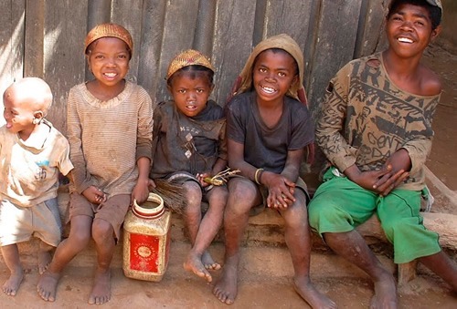Children greeting with smiles in the village in Madagascar.