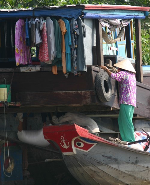 Family closet in a boat floating on the Mekong River.
