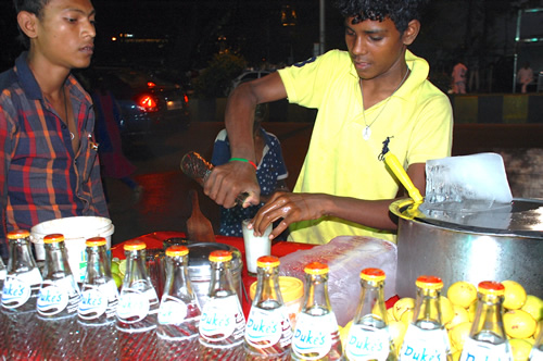 A street vendor preparing a masala soda in Mumbai.