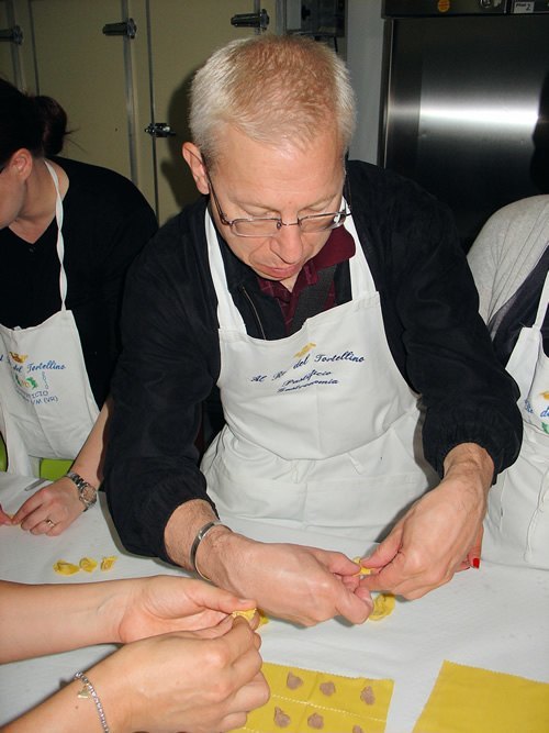 Learning art of folding tortellini in Italy