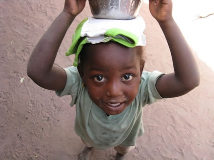 Girl with milk in the Gambia.