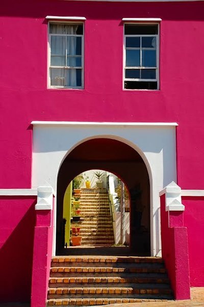 A house with arch and stairs in picturesque Bo-Kaap.
