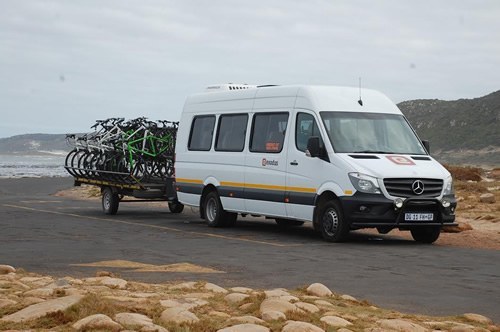 Van carries cyclists luggage in South Africa.