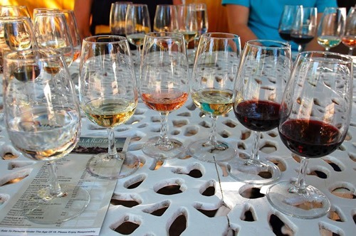 Wine tasting in Stellenbosch with six glasses with different color wines.