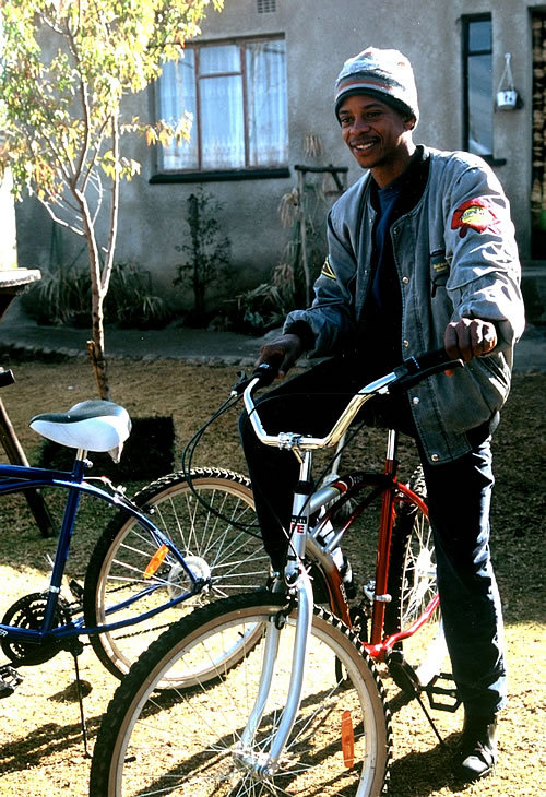 Lebo Malepa in Soweto township on bike.