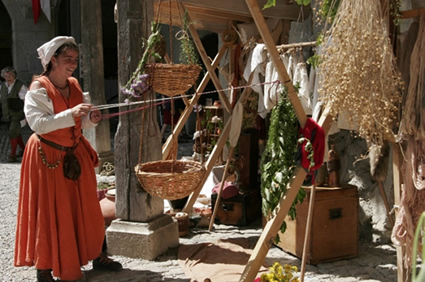 Medieval artisan woman with baskets and handicrafts.