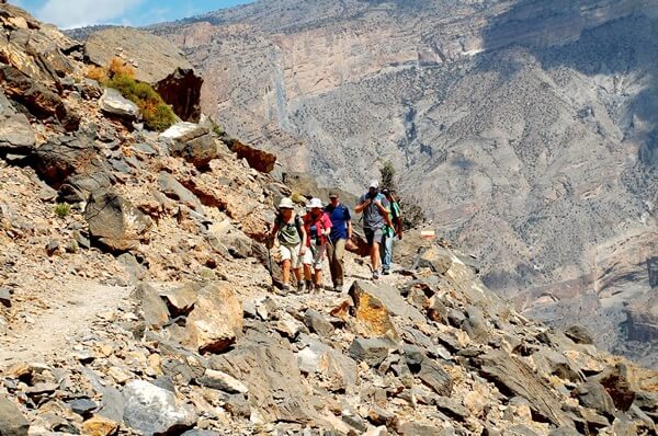 Trekking through the rocky hills of Oman.