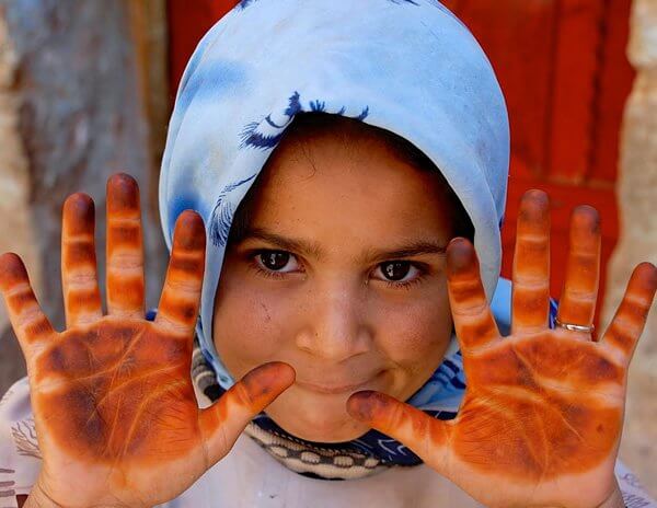 A girl in Yemen showing her hands.
