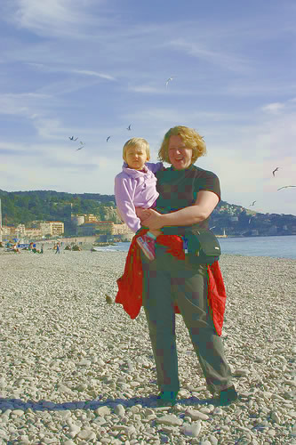 A Family Sabbatical in Nice on a budget, with author on beach with her child.