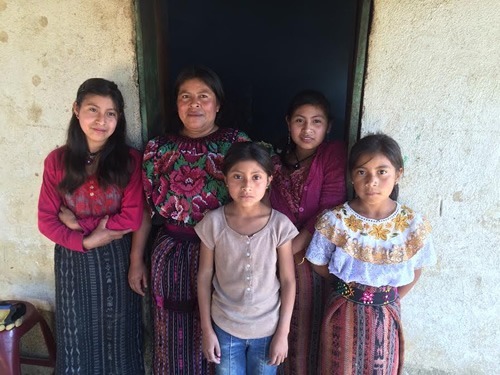A Mayan family in traditional clothing in Guatemala.
