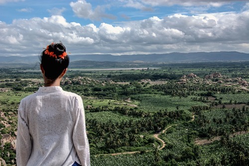 Woman overlooking Hampi, India.