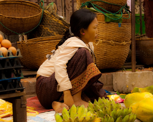 Child selling fruit in Laos.