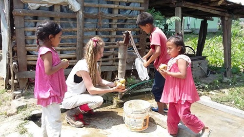 Washing apples with Nepali children.