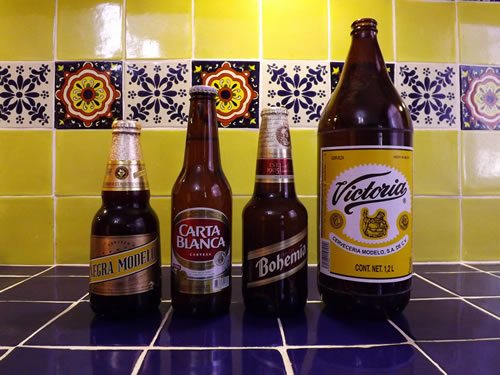 Four bottles out of the rich variety of Mexican beers.