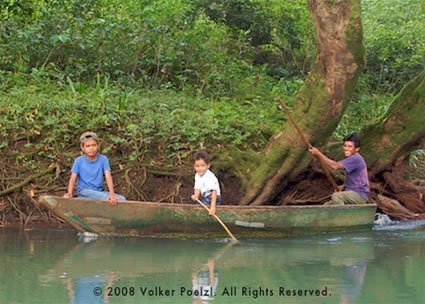 A family in a canoe in Guatemala.