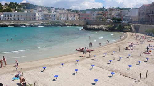 A perfect sandy white beach in the bay at the old town of Santa Maria Al Bagno in Puglia.