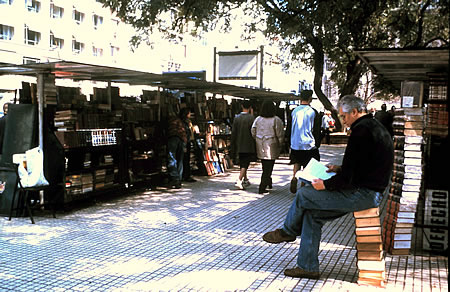 Buenos Aires bookstalls with man reading book.