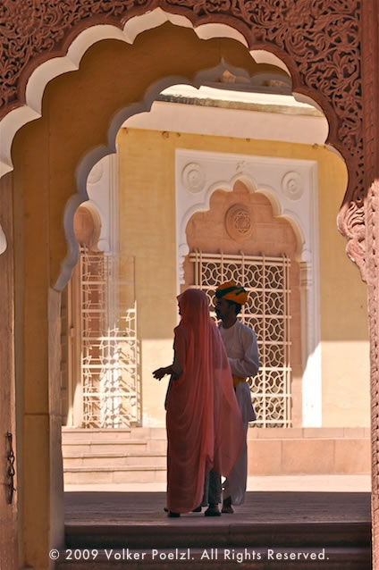 Taking discrete photos of a two people in an Arabic courtyard makes for a great photography subject.