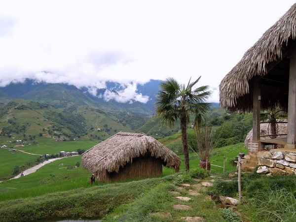 Sapa, huts in the lush greens hills, is the location of the H'mong Cooking School in Vietnam.